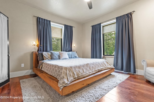 bedroom featuring dark wood-type flooring and ceiling fan