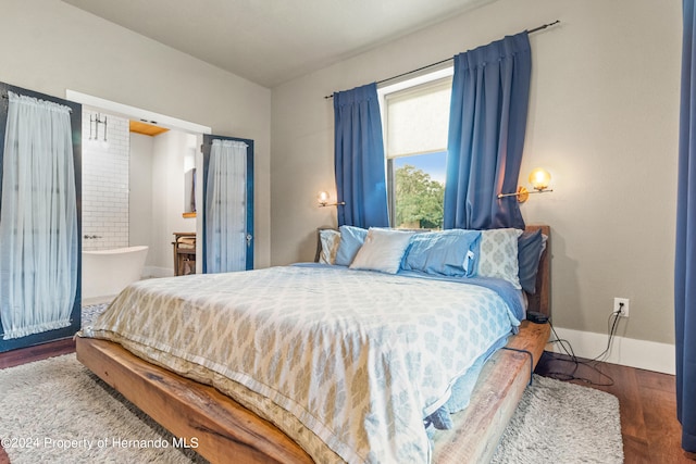 bedroom featuring dark hardwood / wood-style flooring