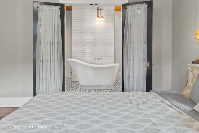 bedroom featuring hardwood / wood-style floors