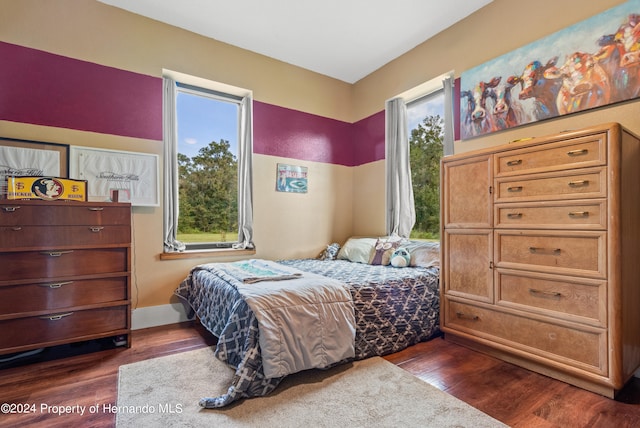 bedroom featuring dark hardwood / wood-style flooring