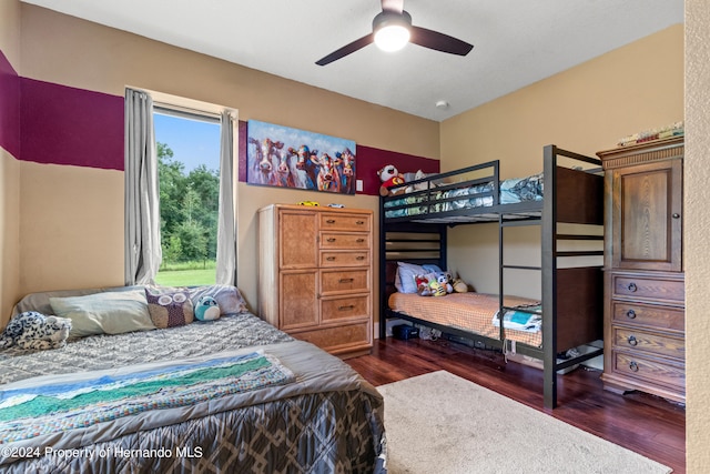 bedroom with dark wood-type flooring and ceiling fan