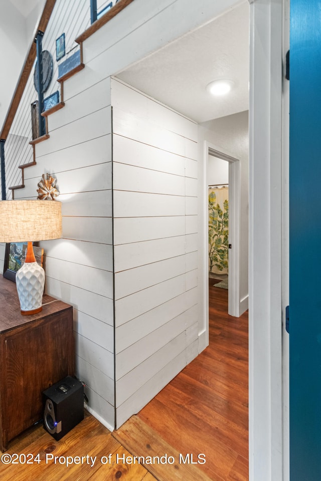 hall with dark hardwood / wood-style flooring