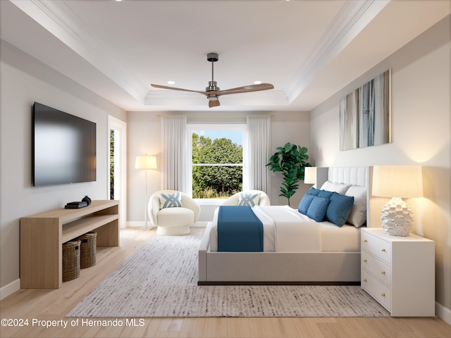 bedroom with ornamental molding, ceiling fan, light hardwood / wood-style floors, and a raised ceiling