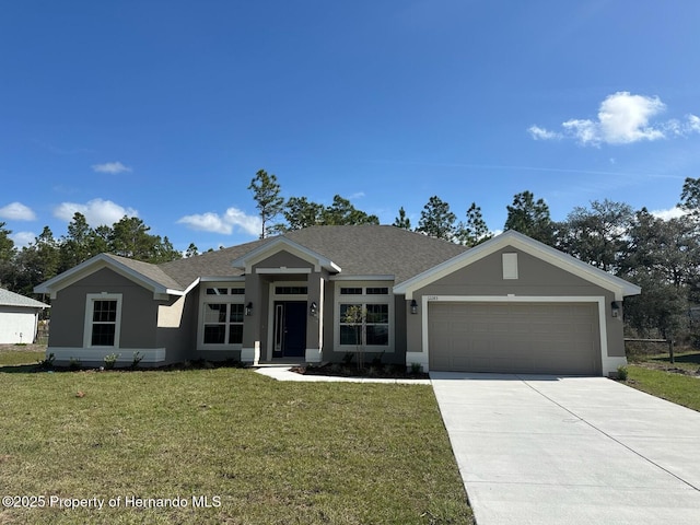 view of front facade featuring a front lawn, an attached garage, driveway, and stucco siding