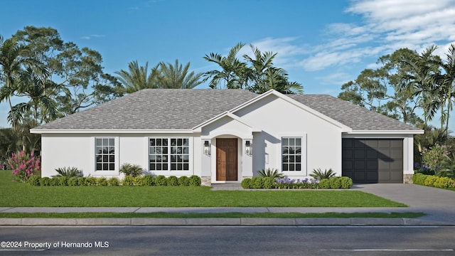 ranch-style home with a front yard and a garage