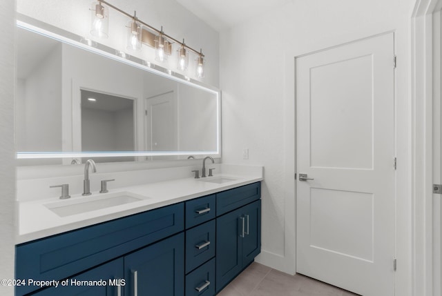 bathroom with vanity and tile patterned floors