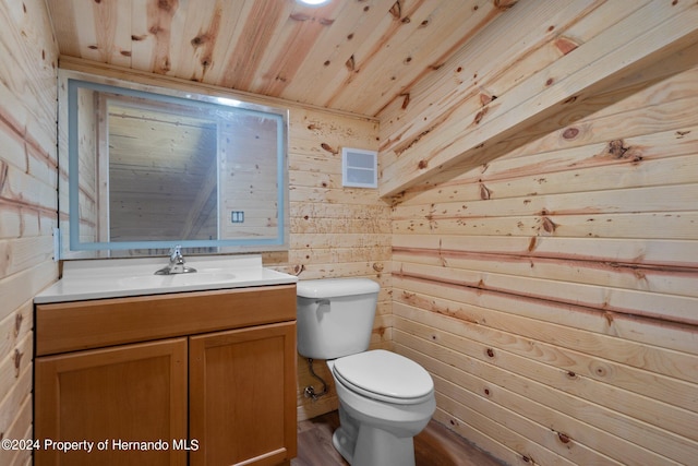 bathroom with vanity, wooden walls, hardwood / wood-style floors, toilet, and wooden ceiling