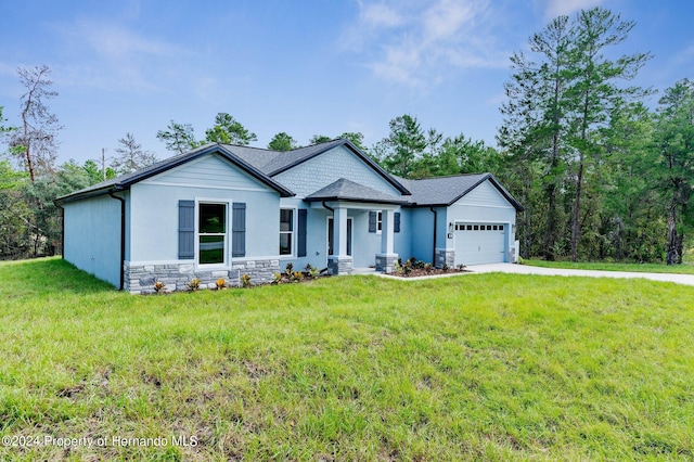 view of front of property featuring a garage, a front yard, and central AC