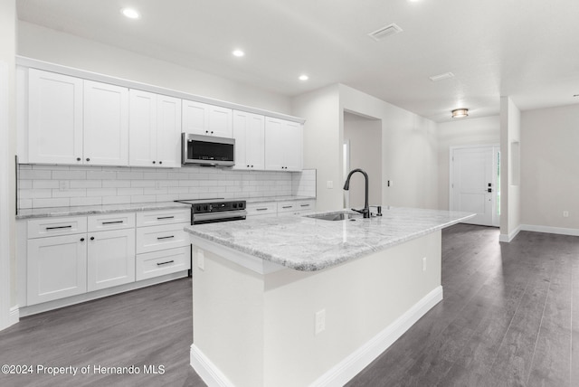 kitchen with a kitchen island with sink, sink, white cabinets, and appliances with stainless steel finishes