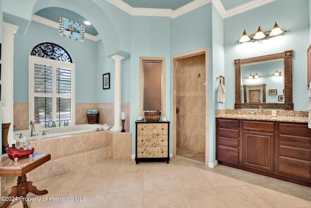 bathroom with independent shower and bath, vanity, crown molding, tile patterned floors, and ornate columns