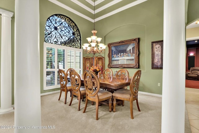 dining area featuring light colored carpet, ornate columns, and crown molding