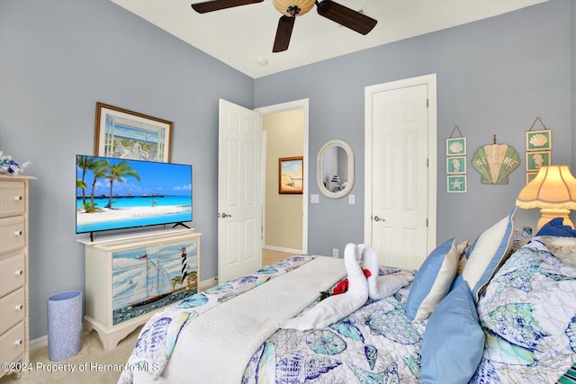 carpeted bedroom featuring ceiling fan