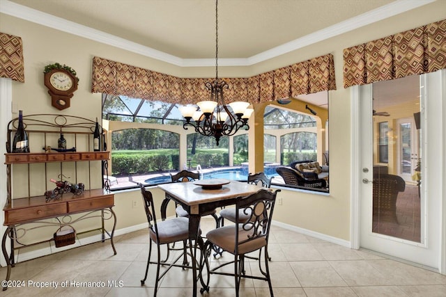 tiled dining area featuring an inviting chandelier and ornamental molding