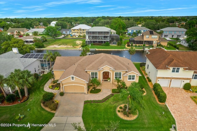 birds eye view of property with a water view