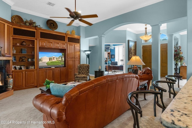 living room featuring ornate columns, ceiling fan, crown molding, and light tile patterned floors