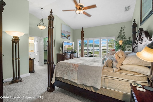 bedroom featuring ceiling fan, connected bathroom, light carpet, and lofted ceiling