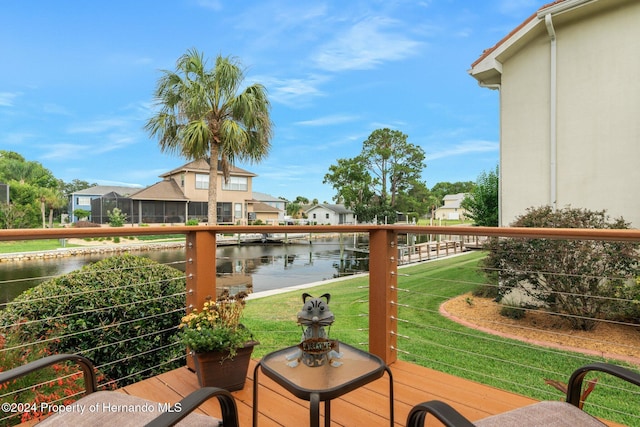 balcony featuring a water view