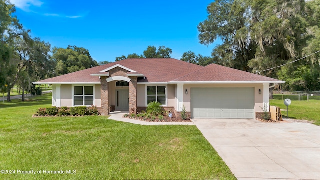 ranch-style home featuring a garage and a front yard