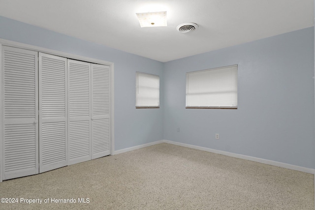 unfurnished bedroom featuring a closet