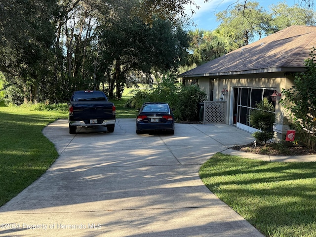 view of property exterior with a yard