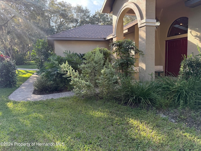 view of side of home featuring a yard