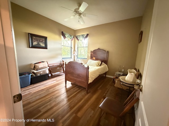 bedroom featuring hardwood / wood-style flooring and ceiling fan