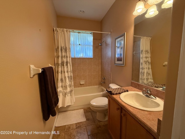 full bathroom with vanity, toilet, and shower / tub combo