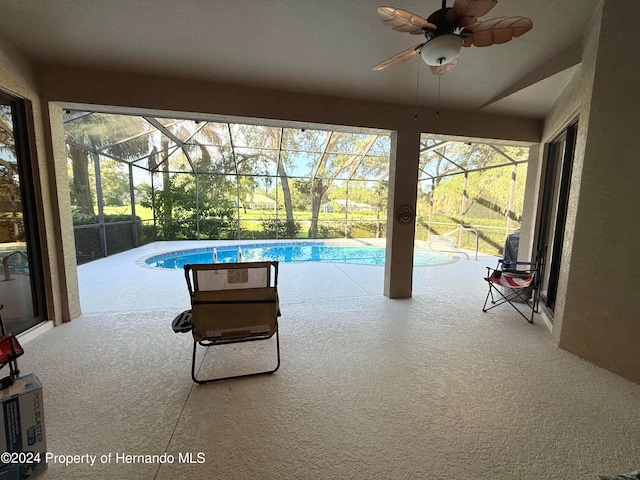 view of swimming pool featuring ceiling fan