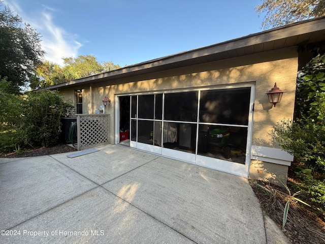 view of side of property featuring a patio