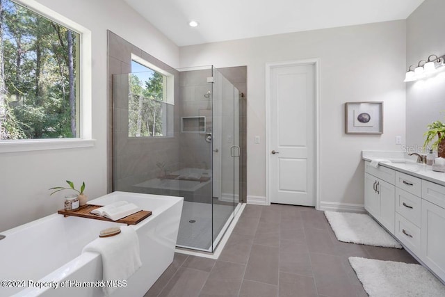 6436 Summit View Dr, Brooksville, FL 34601 - full bath featuring a freestanding bath, a stall shower, vanity, tile patterned flooring, and baseboards
