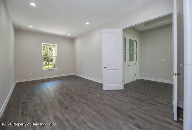 6436 Summit View Dr, Brooksville, FL 34601 - empty room with dark wood-type flooring, baseboards, and recessed lighting