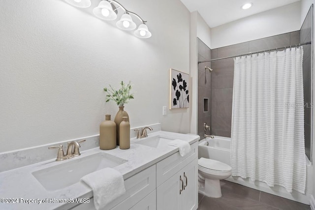 full bathroom featuring toilet, vanity, shower / bath combination with curtain, and tile patterned floors