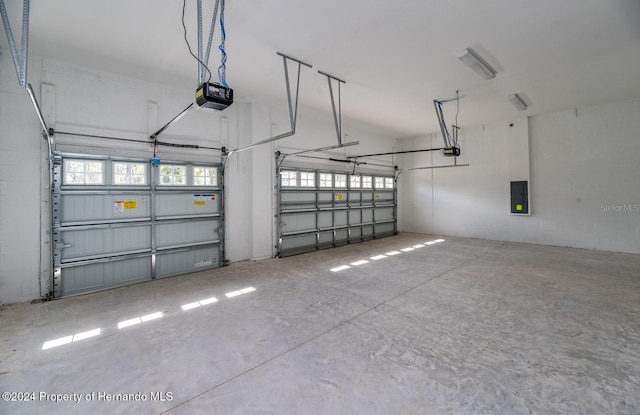 6436 Summit View Dr, Brooksville, FL 34601 - garage with a garage door opener and electric panel