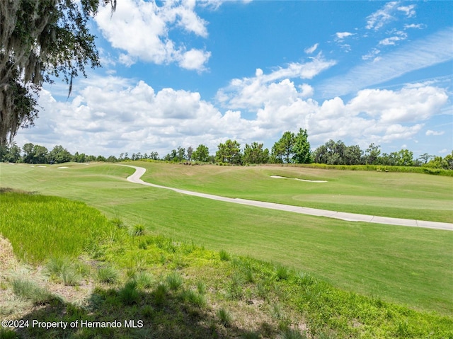 surrounding community featuring a lawn