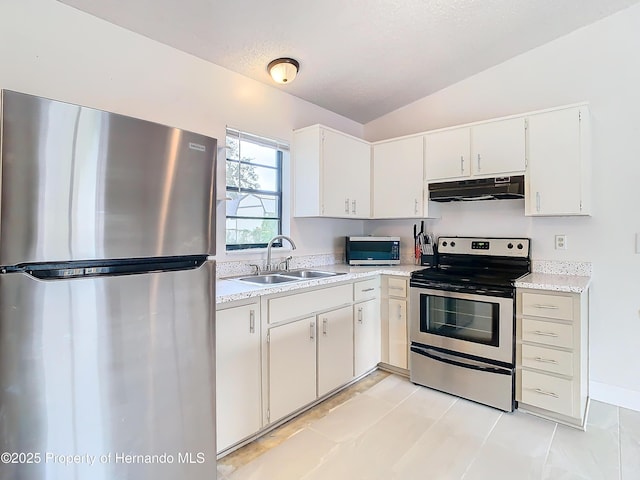 kitchen with white cabinetry, sink, vaulted ceiling, and appliances with stainless steel finishes