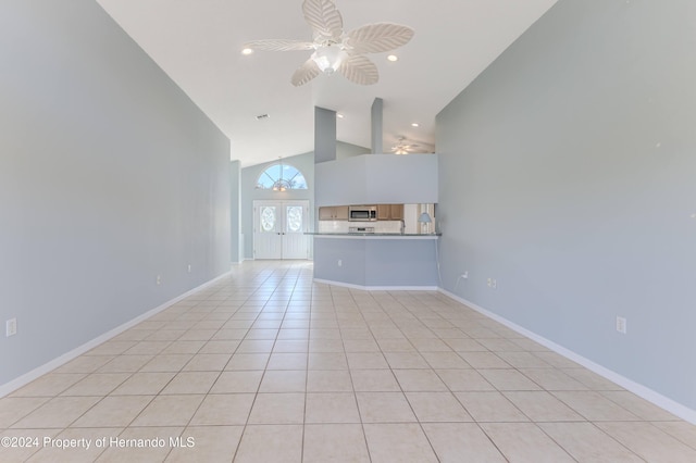 unfurnished living room featuring high vaulted ceiling, ceiling fan, and light tile patterned flooring