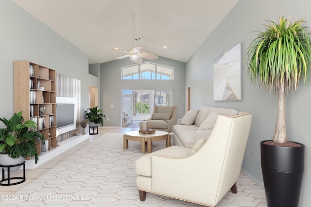 tiled living room with ceiling fan and high vaulted ceiling