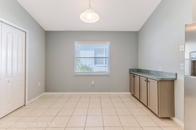 unfurnished dining area with light tile patterned floors