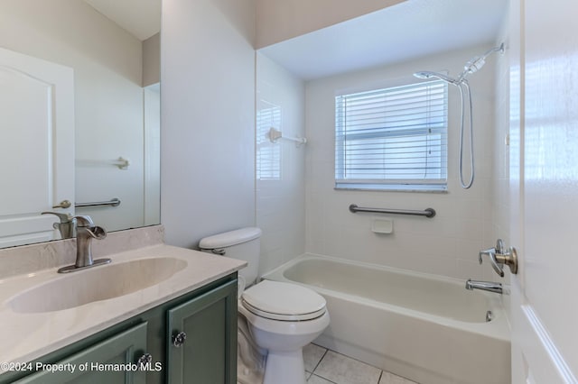 full bathroom with tile patterned flooring, vanity, toilet, and tiled shower / bath