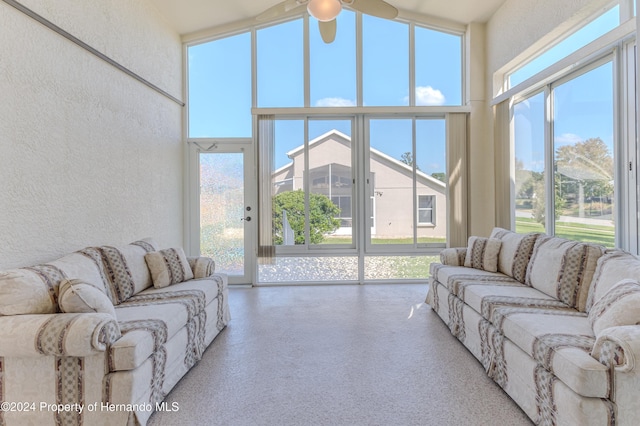 living room featuring high vaulted ceiling, a wealth of natural light, and ceiling fan