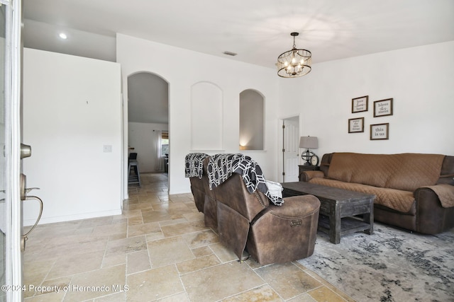 living room featuring a notable chandelier