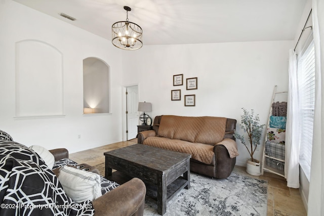 living room with an inviting chandelier