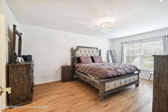 bedroom with light wood-type flooring