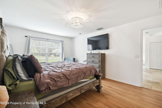 bedroom featuring light hardwood / wood-style flooring