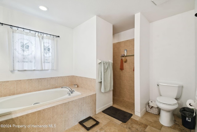 bathroom featuring plus walk in shower and toilet