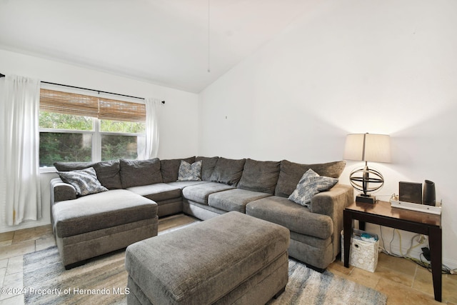 living room featuring vaulted ceiling