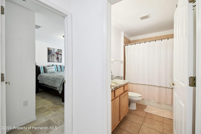 full bathroom with vanity, toilet, and shower / bathtub combination with curtain