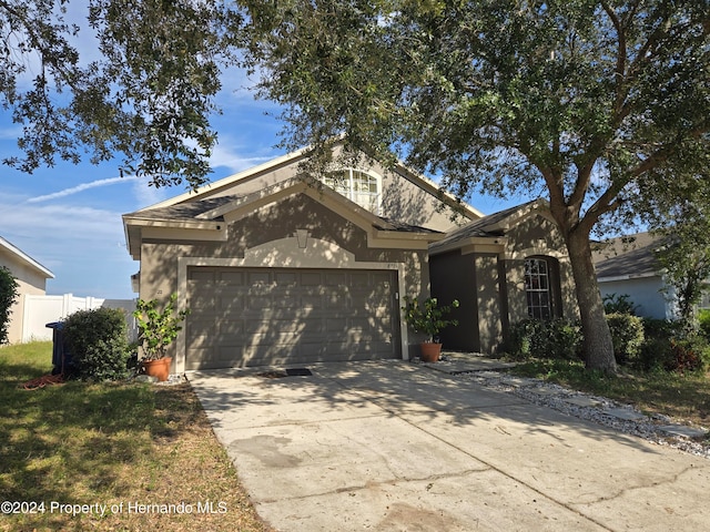 view of front of home with a garage