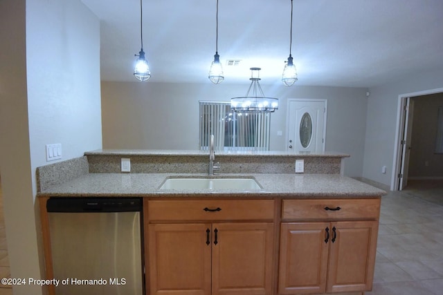 kitchen featuring pendant lighting, dishwasher, sink, a notable chandelier, and light tile patterned flooring