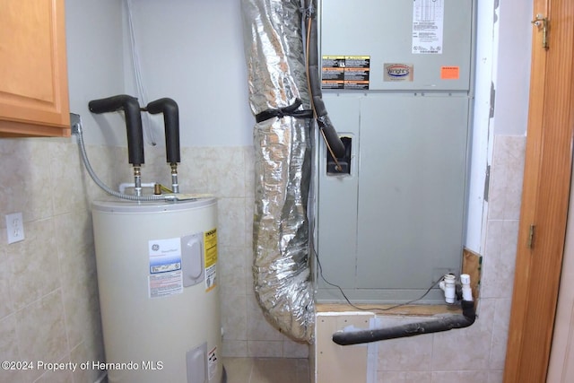 utility room featuring water heater